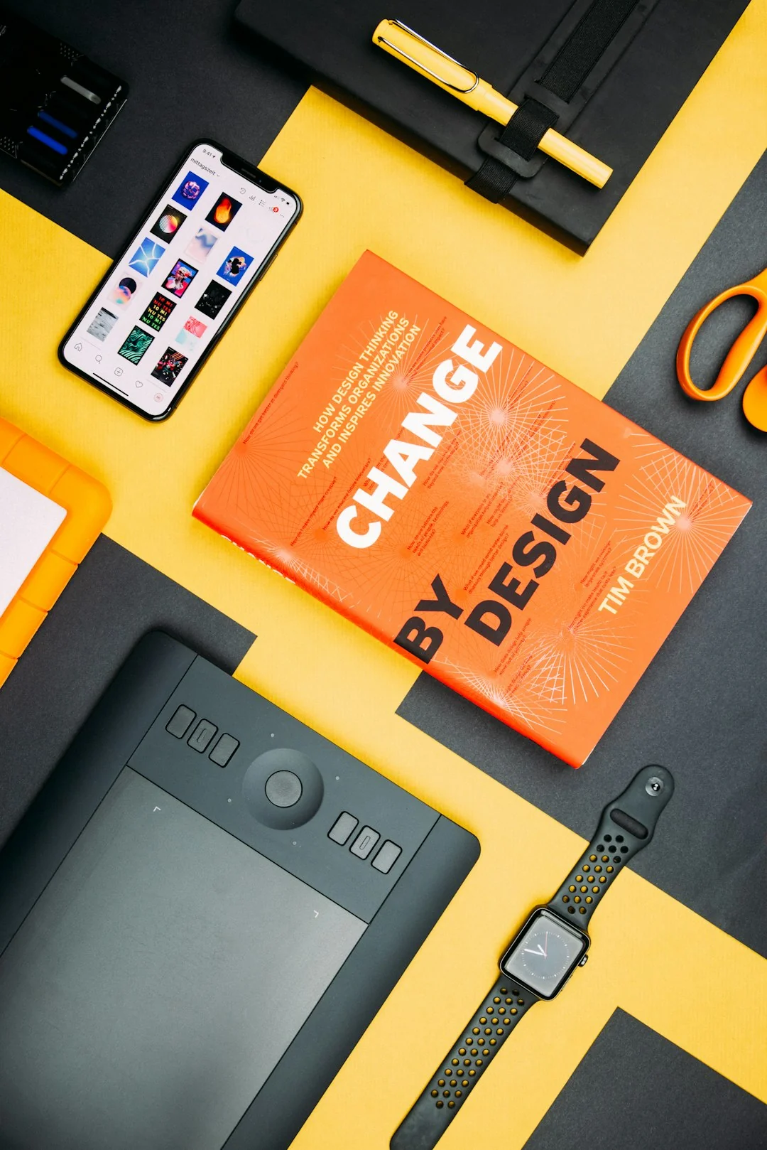 Close-up view of a social media marketing document lying on a desk beside a pen and notebook.